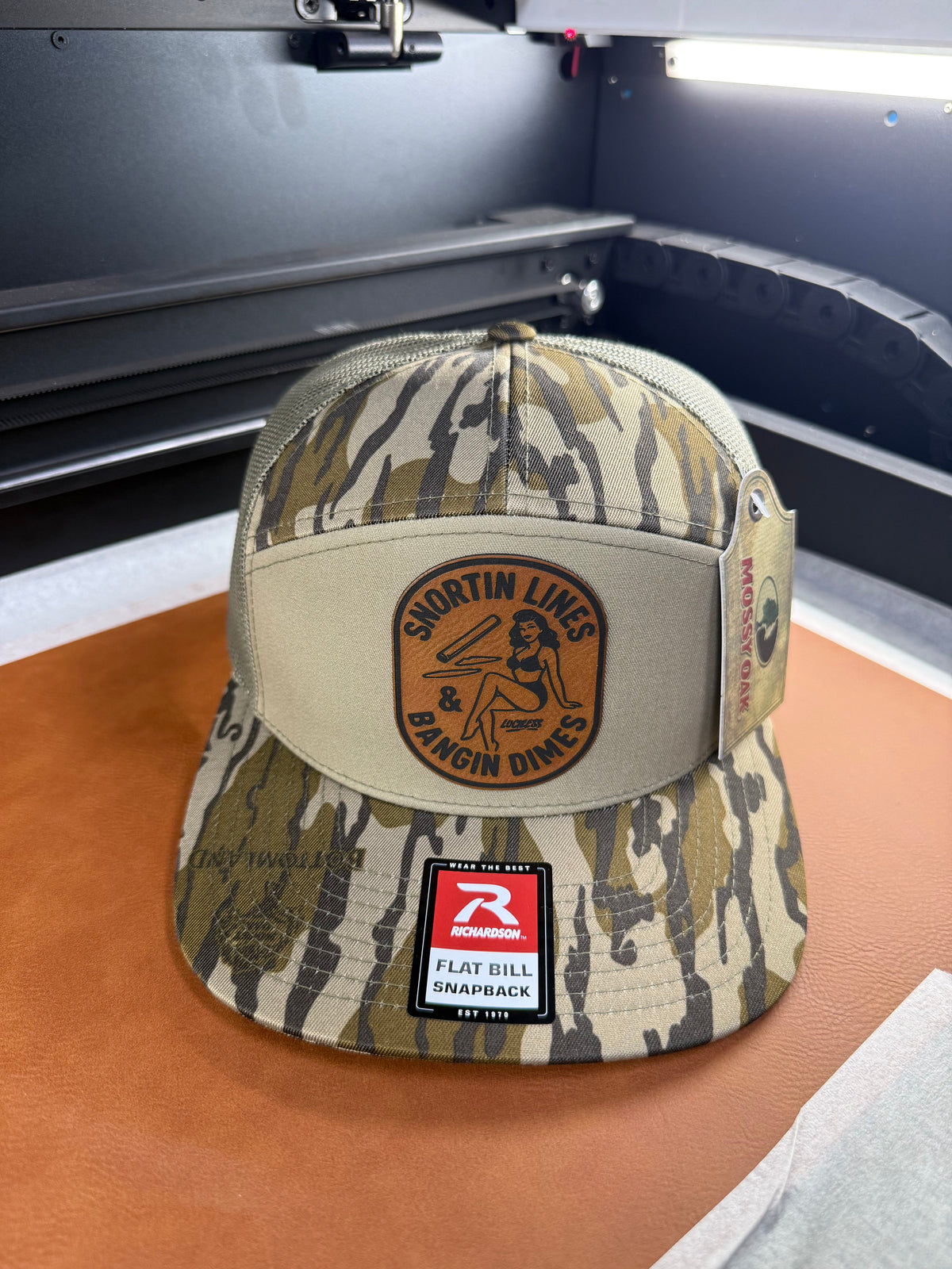 Lines and Dimes Mossy Oak Rawhide Leather Patch Hat