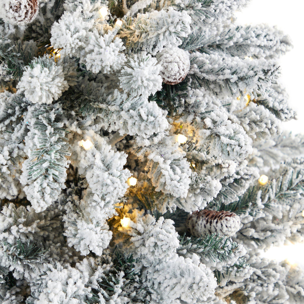 4.5’ Flocked Livingston Fir Artificial Christmas Tree with Pine Cones and 150 Clear Warm LED Lights in Tall White Planter